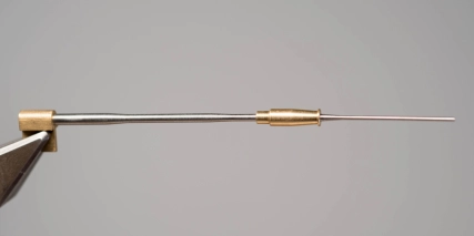 Metal tube on a needle Metal tube on a needle