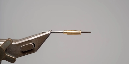Metal tube on a needle Metal tube on a needle