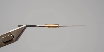 Metal tube on a needle Metal tube on a needle