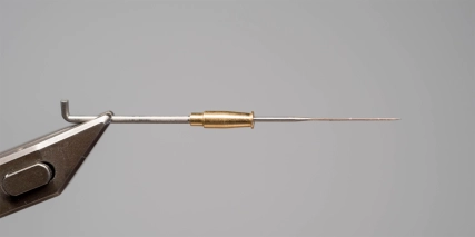 Metal tube on a needle Metal tube on a needle