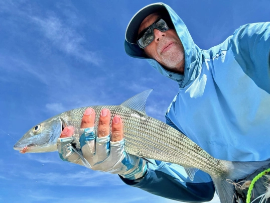 Angler with bonefish Angler with bonefish