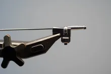 One metal tube in a vise adapter