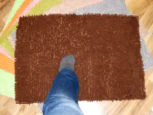Foot on a bathroom mat