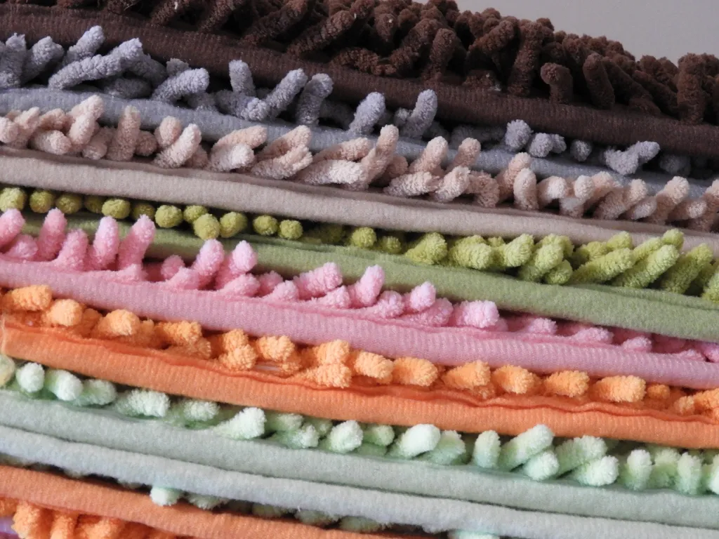 A pile of bathroom mats to server Mop fishing fly material