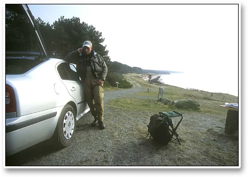 On the phone - Ken on the cell phone. Phones are becoming a more and more important part of the Danish coastal fishing. Some consider them a menace, but we tend to consider them a very long range 'fish finder'.