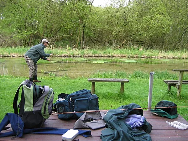 A room with a view - The benches and table right in front of our fishing hut on the Test. Notice the amazing clearity of the water. Under the far bank by those green patches it's probably 2-3 feet deep.