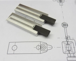 Fitting the carbon fibre parts into the recesses. Fitting the carbon fibre parts into the recesses.