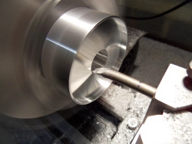 Turning the flange part of the spool. Turning the flange part of the spool.