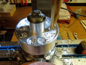 Milling of the weight reduction holes with a rotary table. Milling of the weight reduction holes with a rotary table.