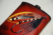 Flask with a classic salmon fly Flask with a classic salmon fly