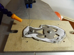 Sawing the precise fish shape and the holes inside with a jigsaw. Sawing the precise fish shape and the holes inside with a jigsaw.