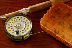 Rod, reel, & dry fly box still life Rod, reel, & dry fly box still life