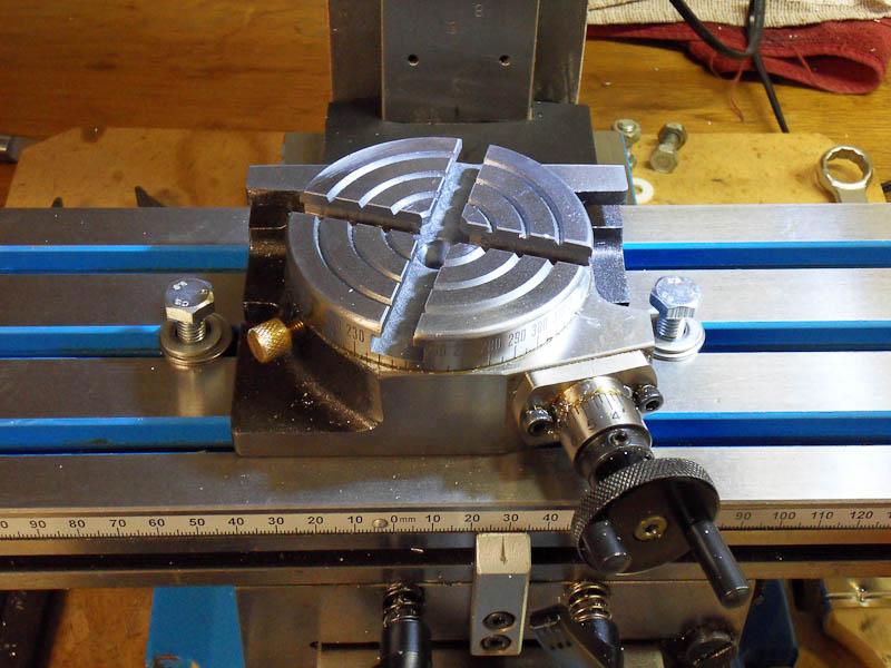 A small rotary table on the milling machine table. Global FlyFisher
