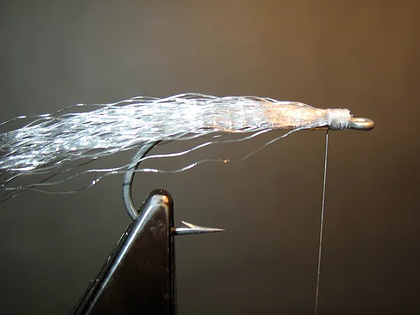 Step 2, tie on the first wing layer. - Continue by adding layers.