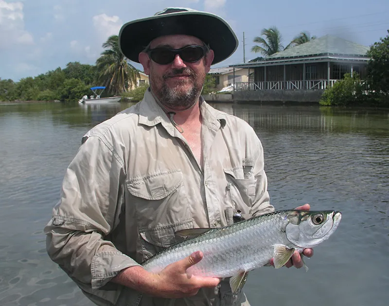 Baby tarpon - Ian with a small tarpon from a back canal