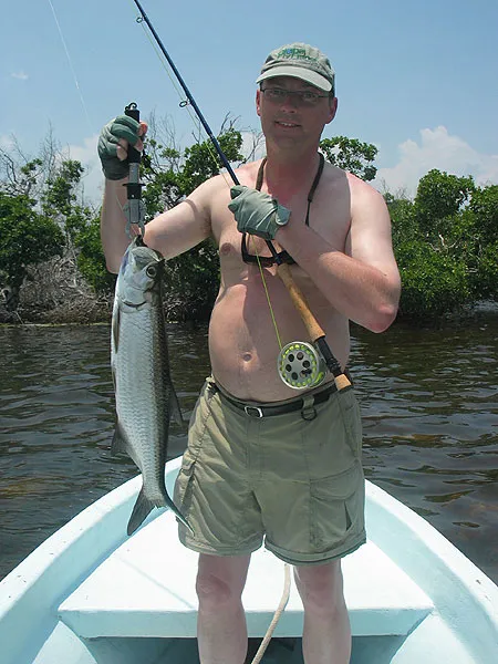 Weighty - Not the tarpon, but me! This picture made me realize that I might want to shed a few pounds around the waist - and maybe a bit more than the 4 lb.s or a couple of kilos that the tarpon weighs.