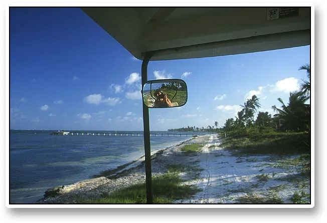 Venturing off - Birgitte caught herself in the rear view mirror of the golf cart while we were venturing off outside San Pedro. Most places where the roads stop you can still ride along the beach, which will bring you to places where few other people come.