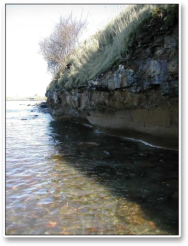 Cliffs and waterline - The rocks and the cliffs of Bornholm makes the island a very special experience. When the water is as high as this, it lends a very special ambience to much of its coast.