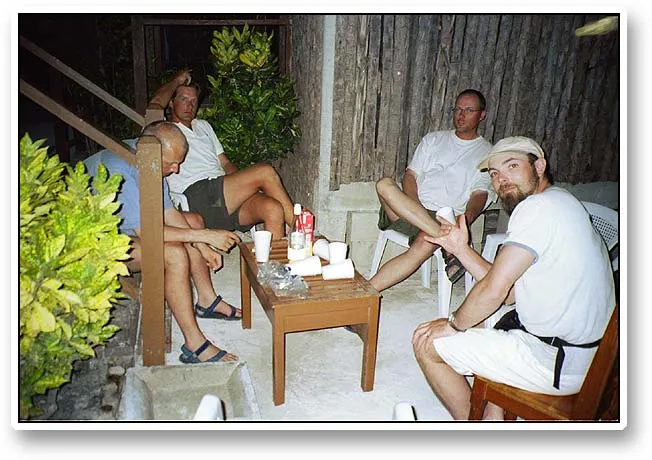 Evening coconut rum - We soon adapted a local drink - a mix of the loacl coconut rum and fruit juice. The big problem was first keeping the ice from melting, then keeping it from freezing together with the extremely small freezer in the house. From left it is: Joachim, Kristian, myself (Martin) and Jan.