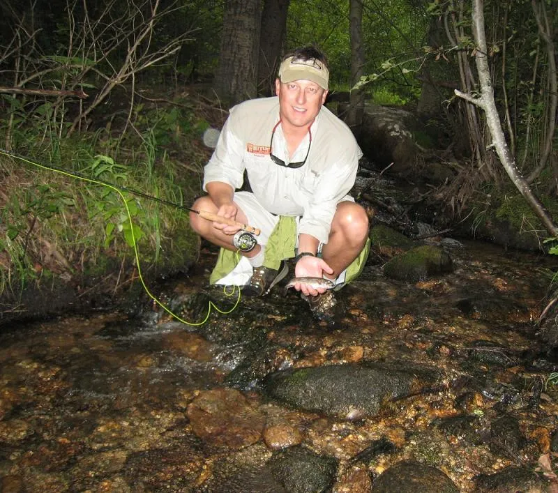 Small stream fishing - Author Steve Schweitzer wet wades a small stream in Rocky Mountain National Park that is barely 6" deep in most spots. The tight canopy cover and narrow stream width is perfect for micro-rodding.