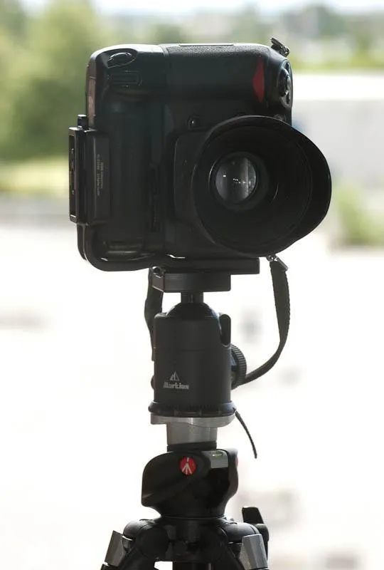 Hefty tripod - I use a very stable tripod with a large ballhead to hold my SLR-camera. Flexible and stable, but neither cheap nor lightweight or compact