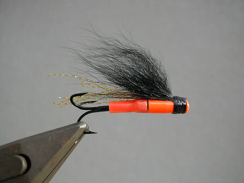 Orange Diver - The Orange Diver owes both its diving abilities and its color to the orange Bidoz brass tube. This short and heavy tube gives a perfect base for a brightly colored salmon fly, that fishes deep.