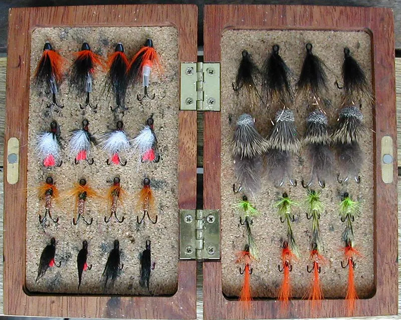 Flybox 2 - This box contains across from the top left: Coned's, Foxes, White Winged Red Tags, SHCZCDNTM's, Copper & Herls, Yellow Small Alley's Shrimps, Red Butts and Orange Small Alley's Shrimps.