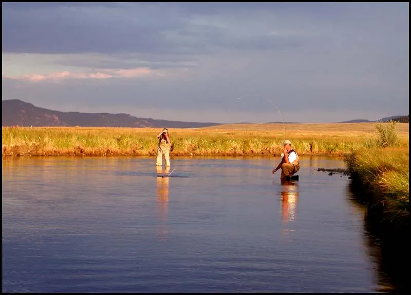 Documentation - Steve documenting Martin documenting Kasper catching a trout in the beautiful sunset.