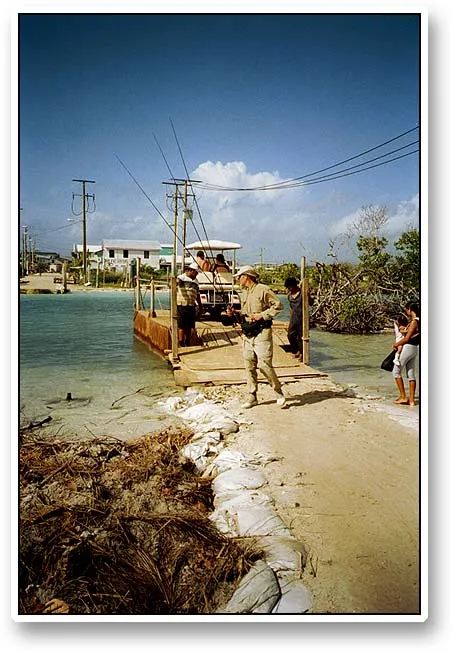 Docking - The ferry across the canal that separates the southern and northern parts of the island seems extremely fragile and ready to tip over any moment. In spite of this it easily carries three golf carts and a bunch of pedestrians at the same time.