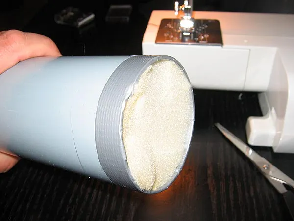 Tape and foam - Covering the end of the tube with duct tape will protect the fabric from being cut, and the foam plug will keep the rods from poking through it.
