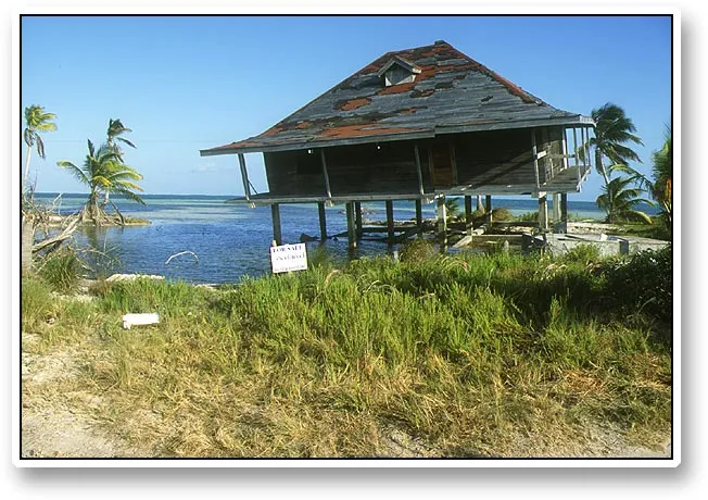 For sale - A storm or one of the hurricanes Mitch or Kieth decided to move this house a bit closer to the water. The owner obviously decided to move it too. Yes, it is for sale...