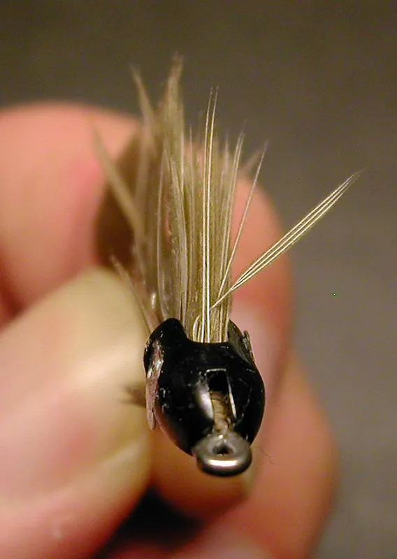 The way it works - The Kameleon heads twist on after the fly is finished. The slit passes over the eye and when you twist the head 90 degrees it locks.