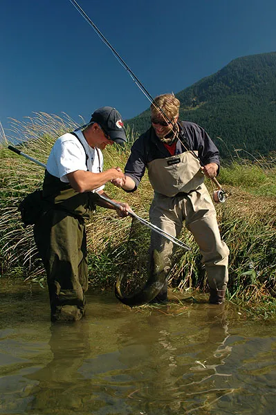 Handshake - Erik and Ole shake hands after the successful landing of a large coho in the Harrison River.
