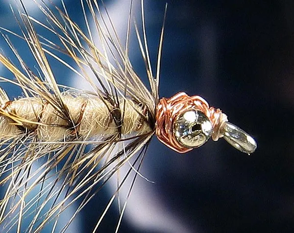 Copper head - The copper wired head was one of the reasons for the early name of this fly. The camel wool body was the second.