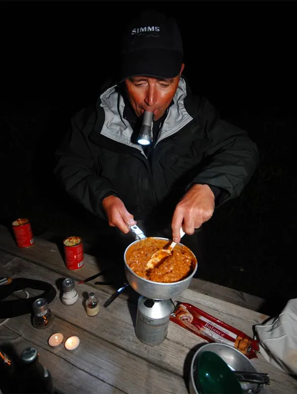 What's cookin'? - Henning is heating a couple of cans of good food.