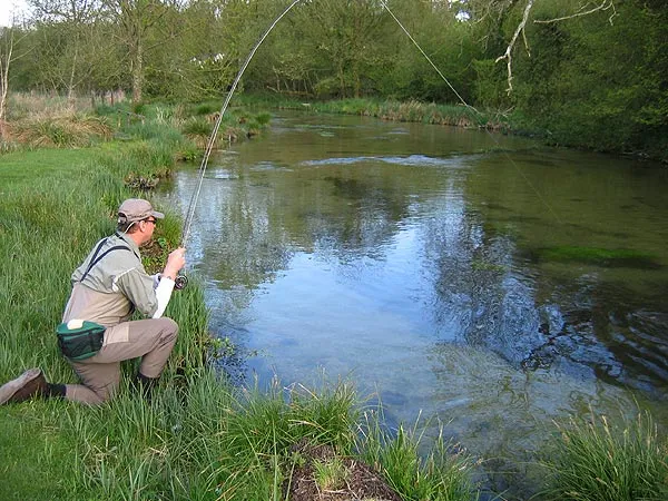 Hooked - There were dozens of fish in this bend on the Test. We managed to spook most of them, but did get a couple to hand too.