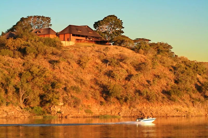 Sun setting on a lakeside lodge -