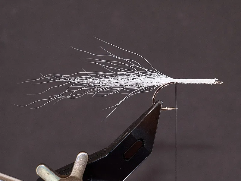 Step 2 - tie in a bunch of white bucktail -