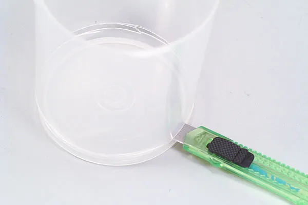 Lid trimming - Trim off the major part of the lid for a stack of CD-RW's and you have a sturdy and lightweight disc for the rotor.