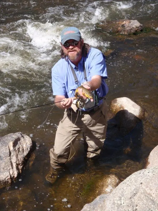 Micro-rodding hoppers along a stream edge - Guide Mark McMillan uses a micro-rod to work large hoppers along a stream edge.