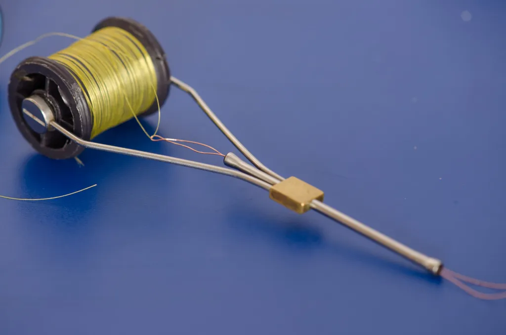 Copper on the way - Using the copper wire as any other threader to catch the tag and pull it through the tube