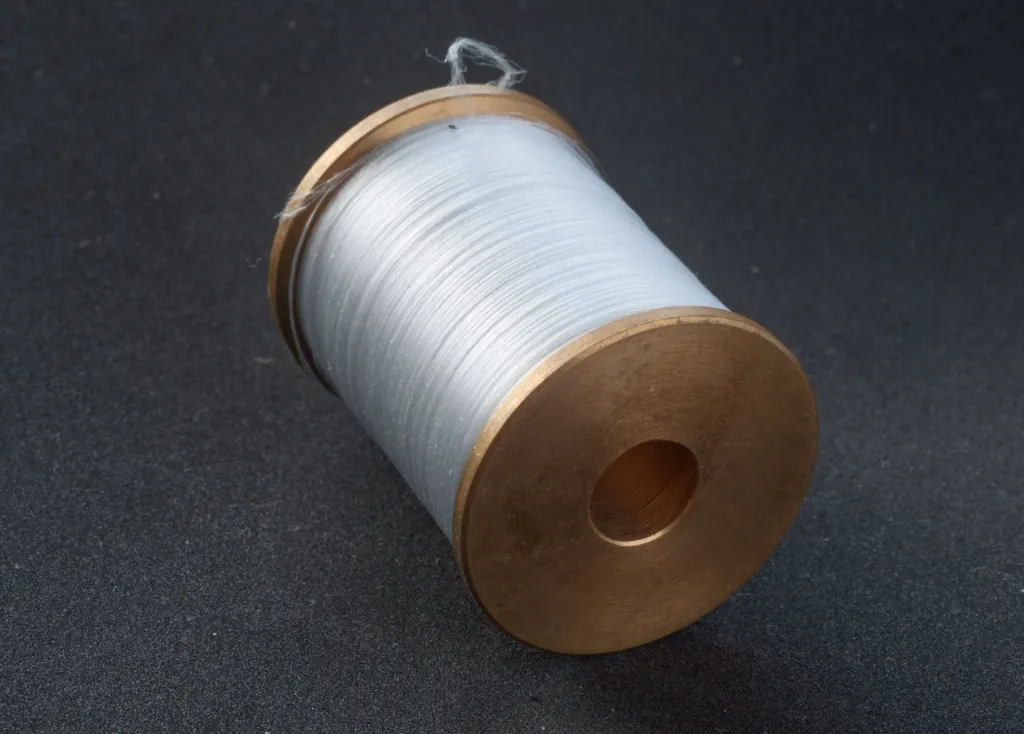 Brass bobbin - With Dyneema thread, courtesy German Wurm