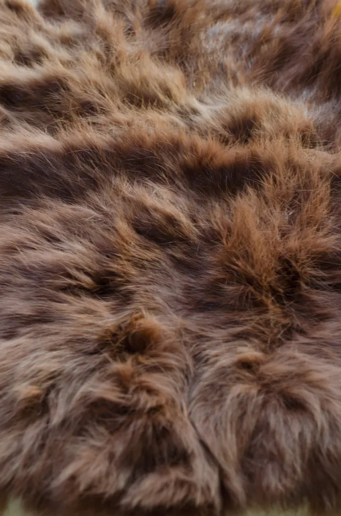 Messy fur - This rabbit skin can be useful for dubbing, but will need a bath and some grooming before it can be used for things like zonker strips. Notice that hair on some is naturally curled, and cannot be groomed straight.