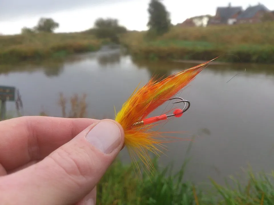 The Yellow Lightning - Det Gule Lyn in Danish, one of Kim\'s stable Munker color combinations. Notice how the orange junction tube and the strike point adds little accents to the rear of the fly