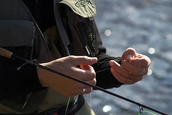 Checking the leader - The fish might not be big, but you still don't want a nick or knot on the thin tippet