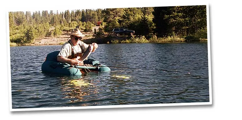 Rich releasing a fish - Rich Lobrowich floating the Saw Mill Lake where he is about to release a nice rainbow.
