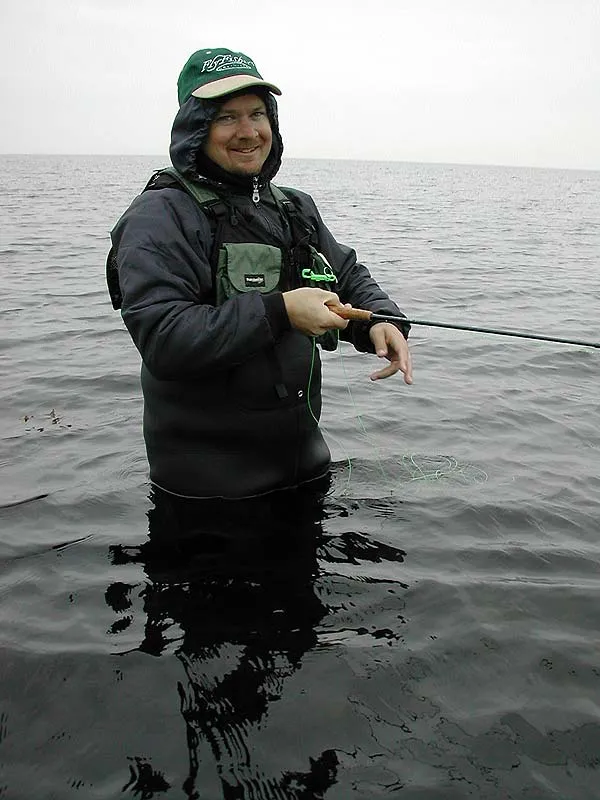 Smiling - Miserable but happy. Derek strips his fly in an attempt to entice a Danish sea trout