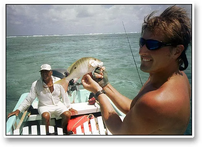 A snapper - Kristian displays a snapper of the size you see all over the place. Ramon - the guide - seems happy too.