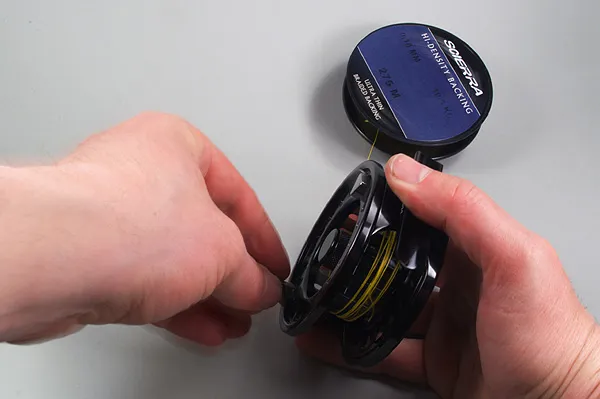 Spooling the backing - Spooling the backing will take its time if you use the manual method. Using a spooler or an electric drill makes the process a lot easier and often results in a more even and tighter layer of backing. Using hand spooling can work equally well, but it just takes longer and requires a bit more attention.