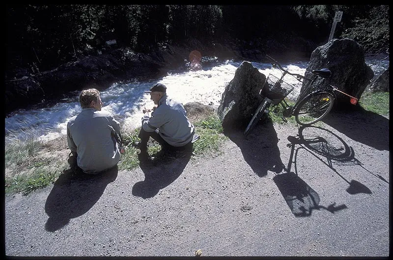 Talking - We met a local old timer on the bank of the river who rode his bike to watch the fish, currents and fishers almost every day.